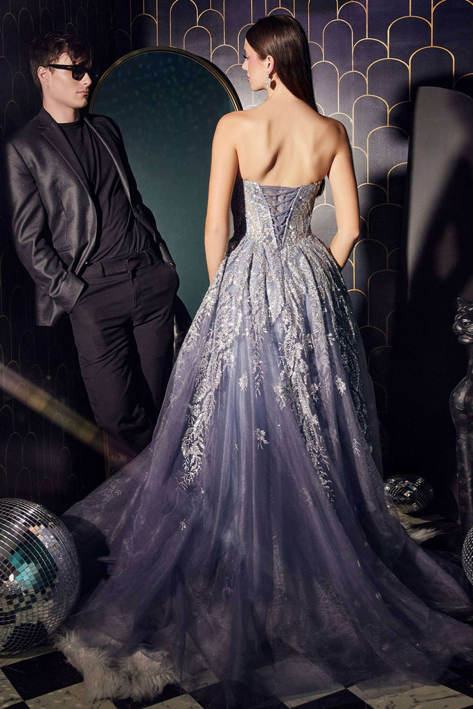 Strapless tulle ball gown in dusty rose with glitter lace corset and layered skirt, ideal for prom or red carpet events. Elegant back view design.