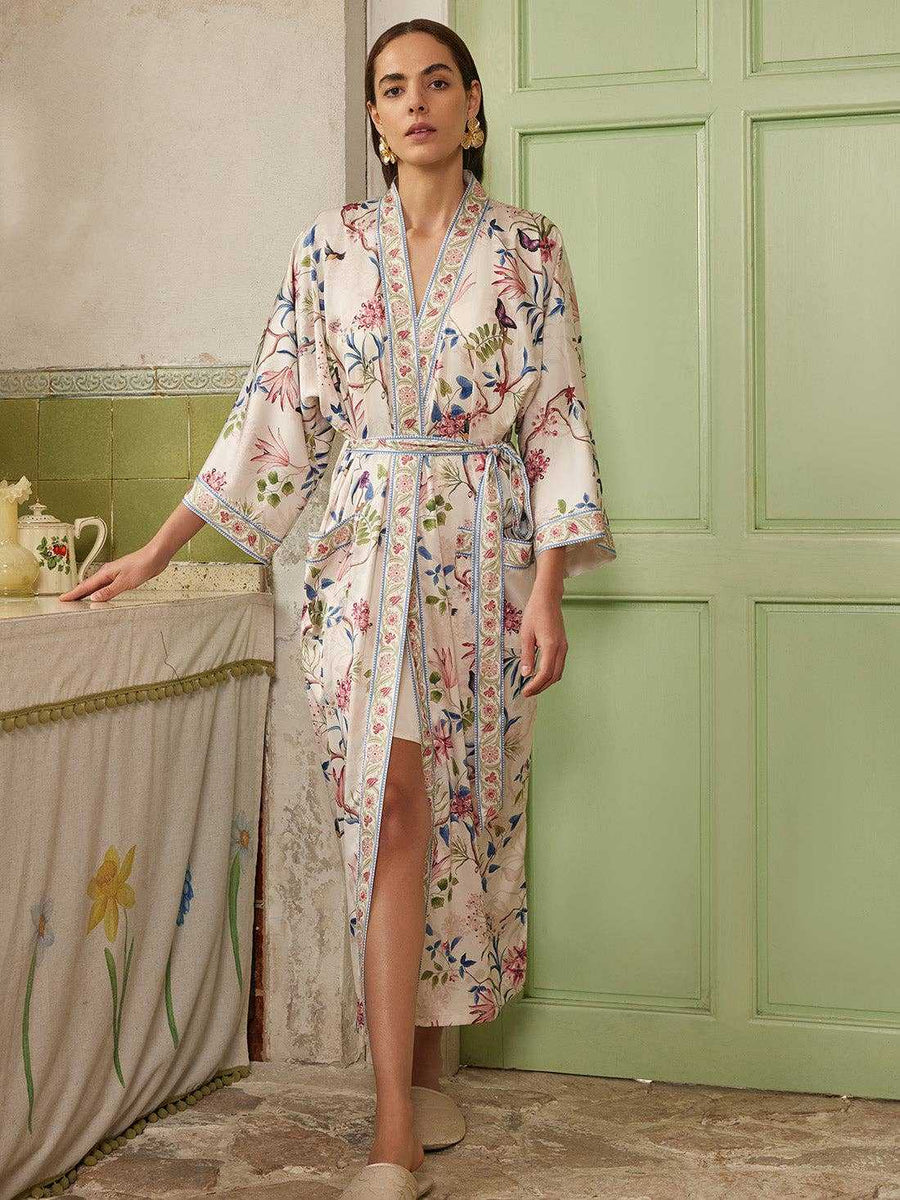 Full-length Beige Chinoiserie Kimono Robe with botanical patterns, styled for bridal loungewear. One-size wrap fits S to XL.