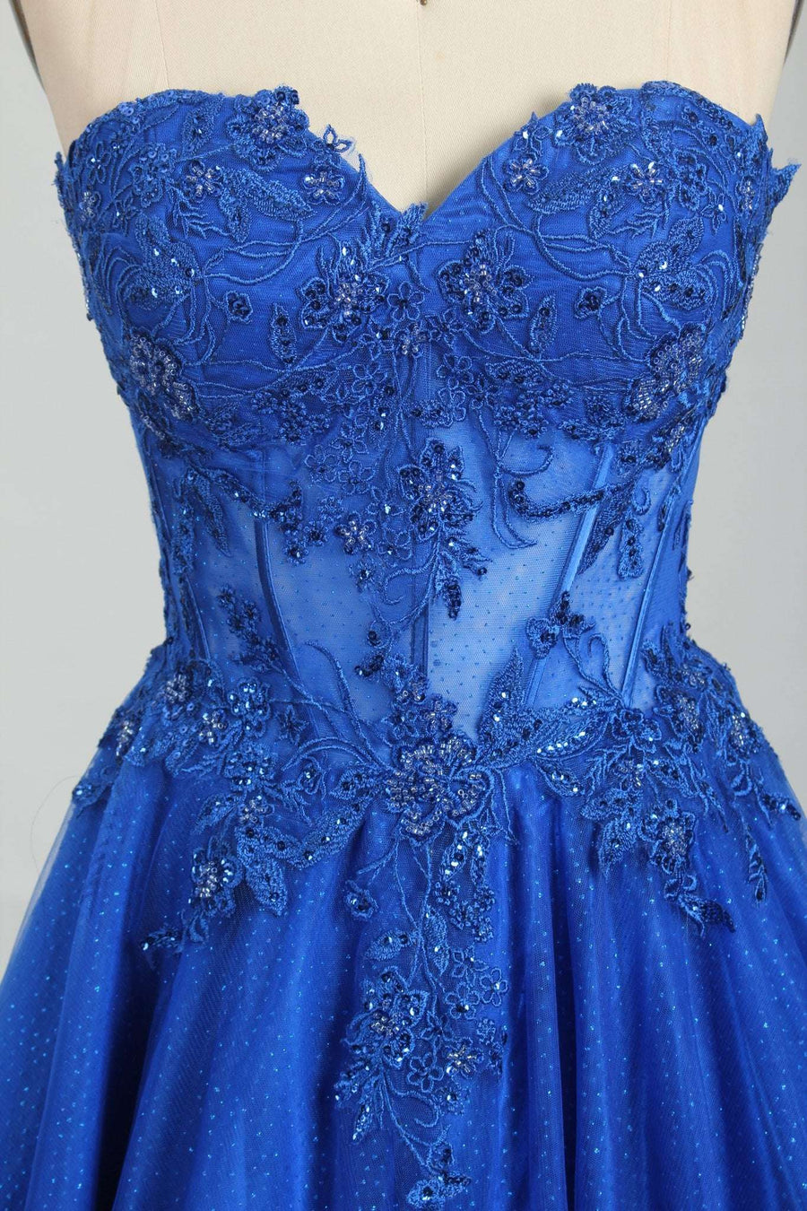 Close-up of Leah Royal Blue Sweetheart Corset Ballgown showing intricate floral beading and sheer structured corset detail. Elegant formalwear design.