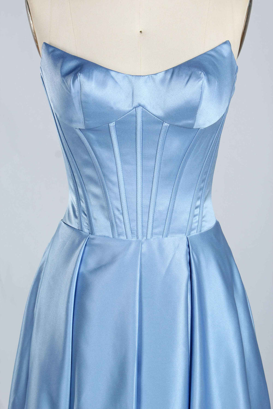 Close-up of dusty blue Jessica Stuart Darcet Prom Gown bodice featuring boning and sweetheart neckline for a sculpted silhouette.