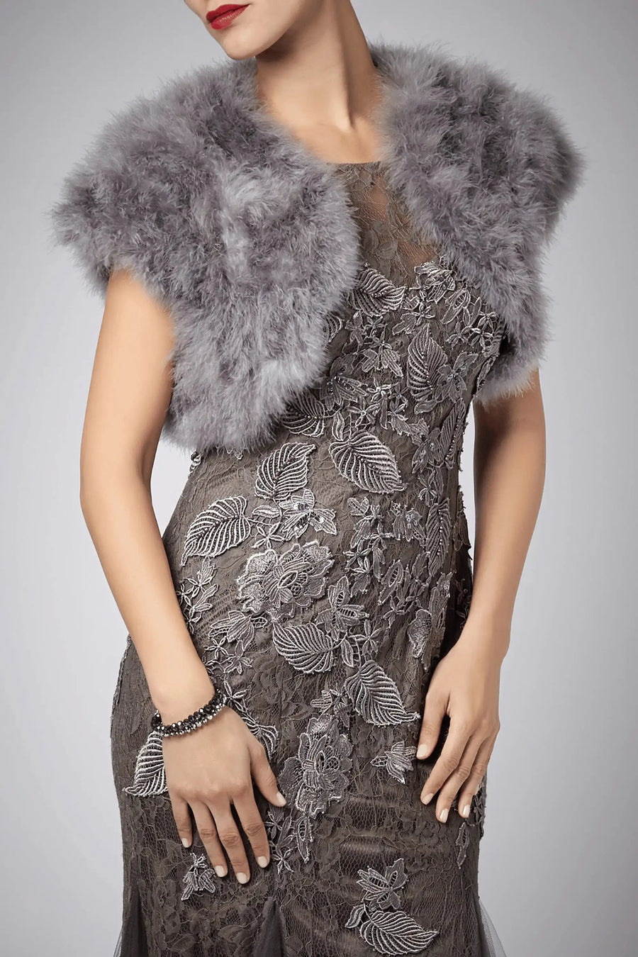 Charcoal grey Feather Shrug FK042 by Mascara London paired with a lace evening dress, perfect for balls or formal gatherings.