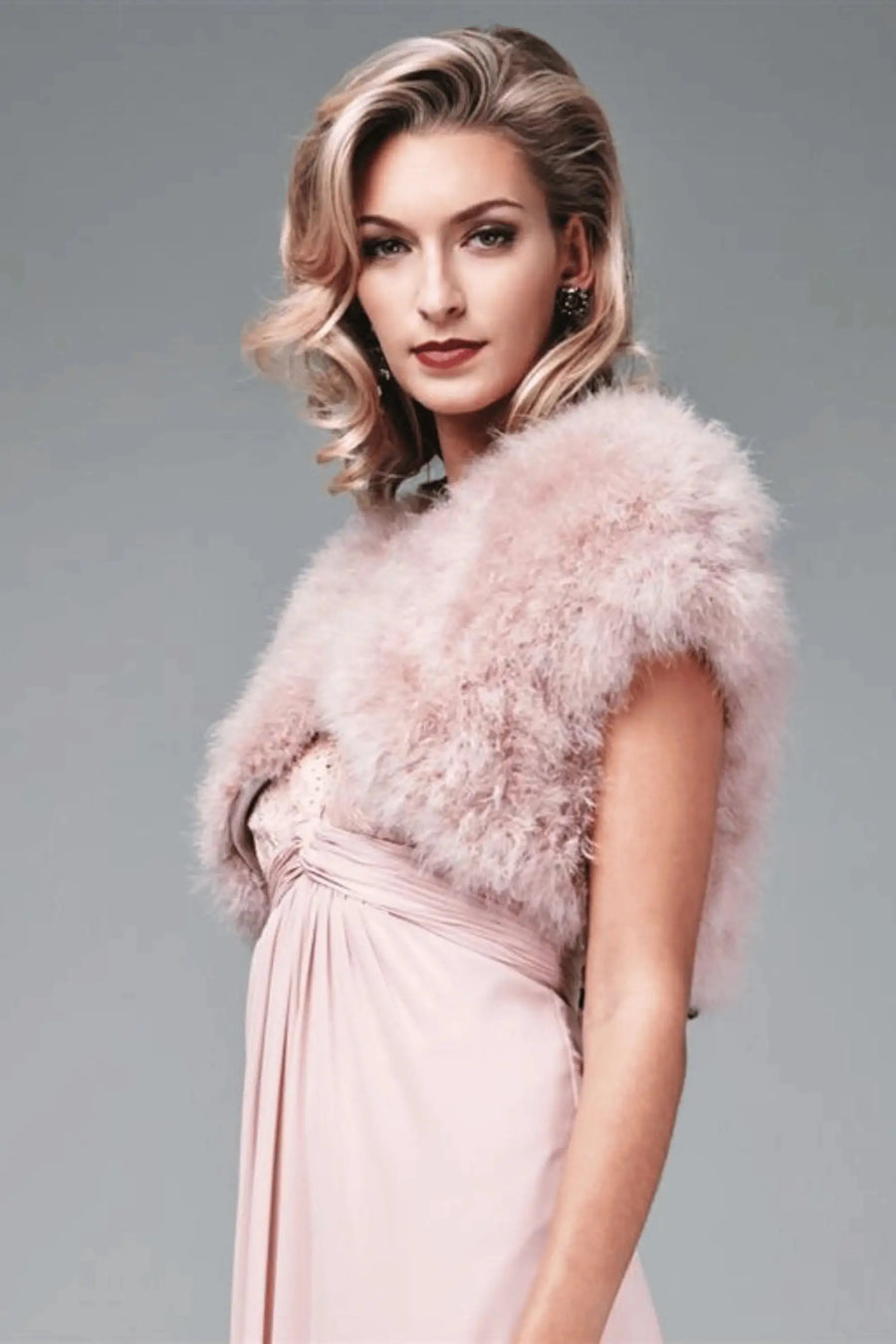 Soft pink Feather Shrug FK042 by Mascara London styled with a blush gown, ideal for prom or bridesmaid wear.
