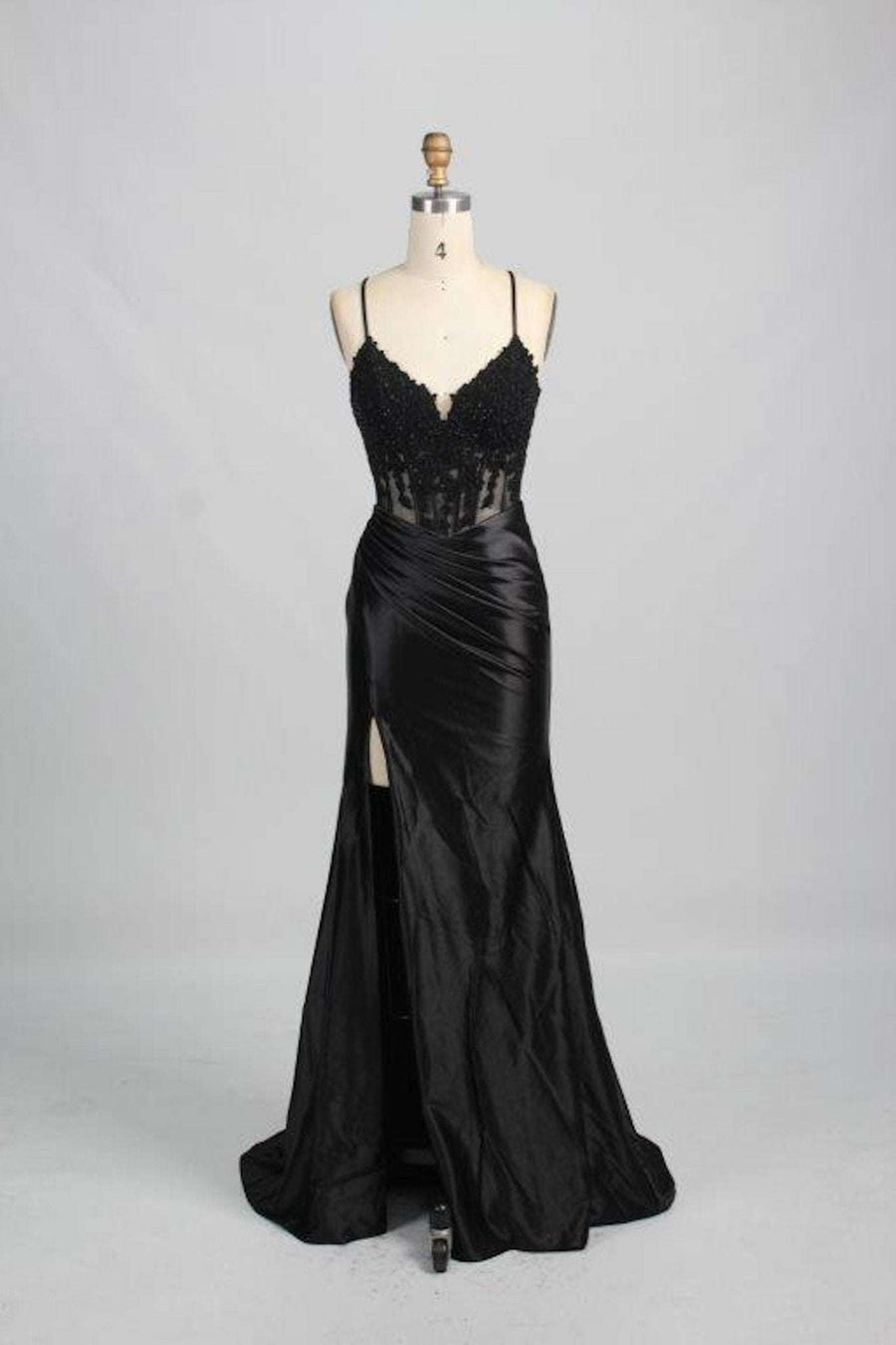 Jessica Stuart Black Corset Satin Prom Dress with embellished corset bodice, thigh-high leg slit, and string tie back on display mannequin.