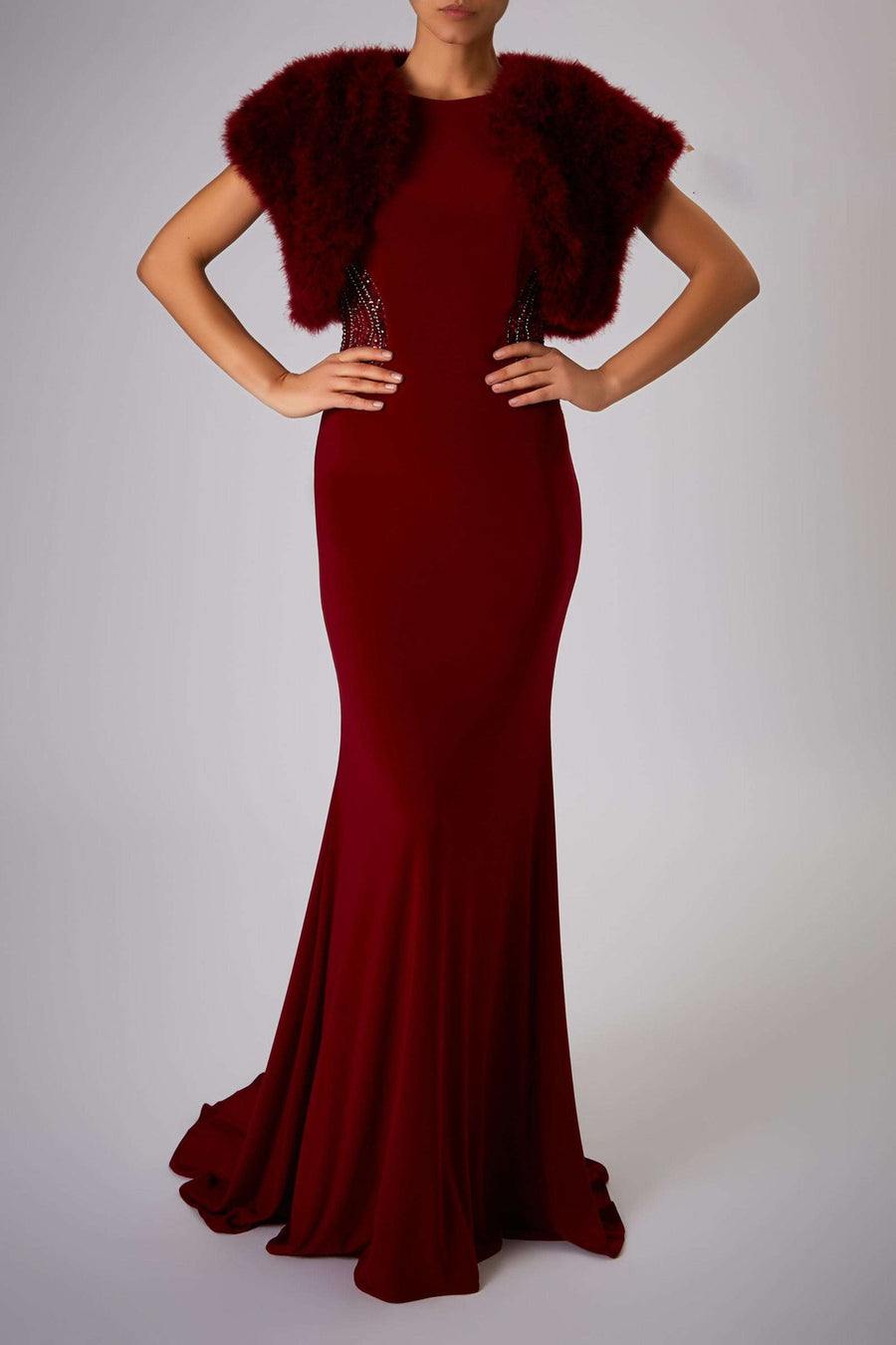 Wine red Feather Shrug FK042 by Mascara London paired with a floor-length gown, ideal for weddings or formal evening wear.