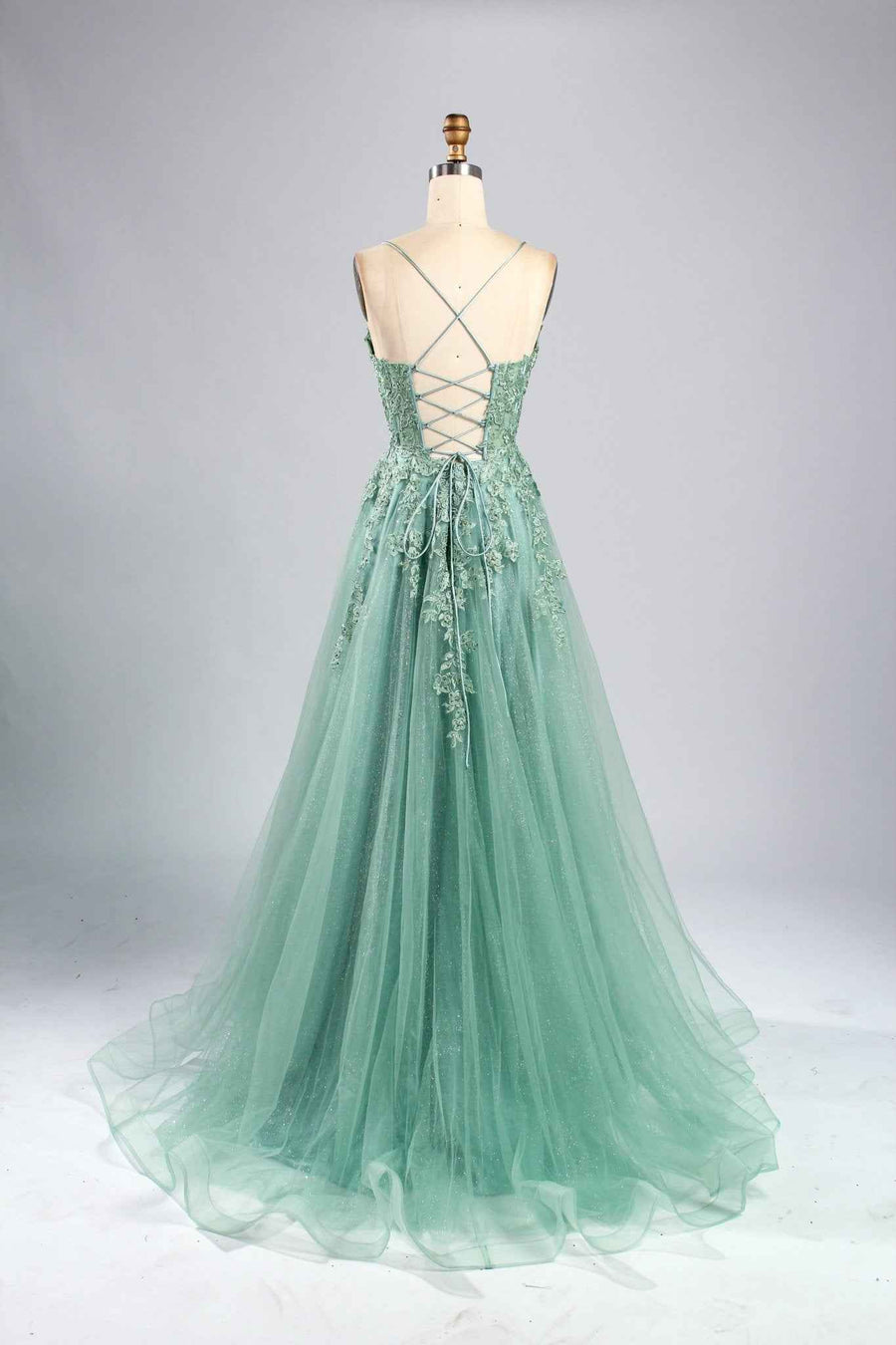 Back view of Joy Sage Green Floral Applique Tulle Ballgown by Jessica Stuart, featuring lace-up corset and embroidered floral details on flowing tulle.