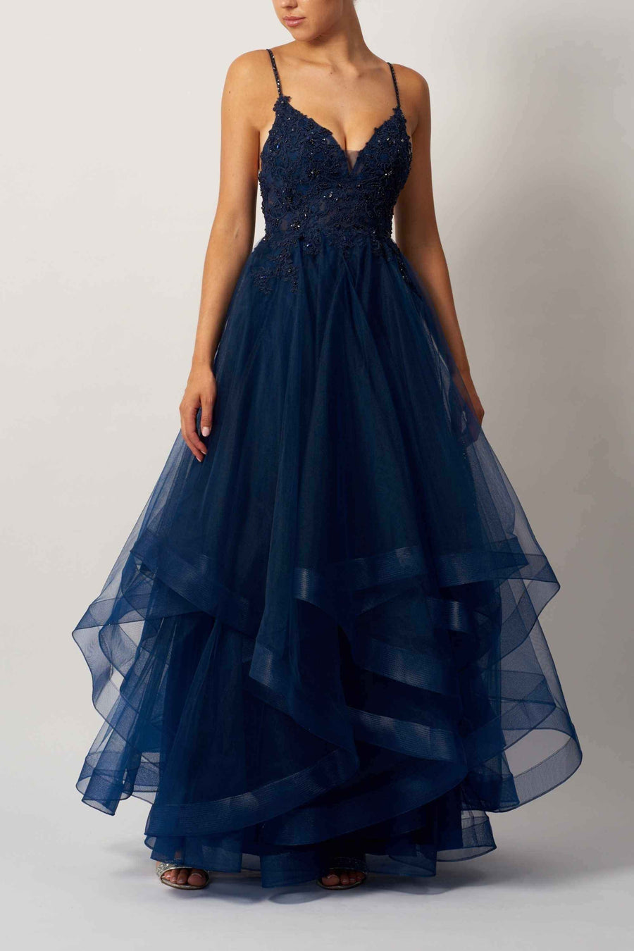 Mascara MC110117 navy prom ballgown with lace bodice, sparkle straps, and tiered net tulle skirt. Elegant choice for formal events or prom night.