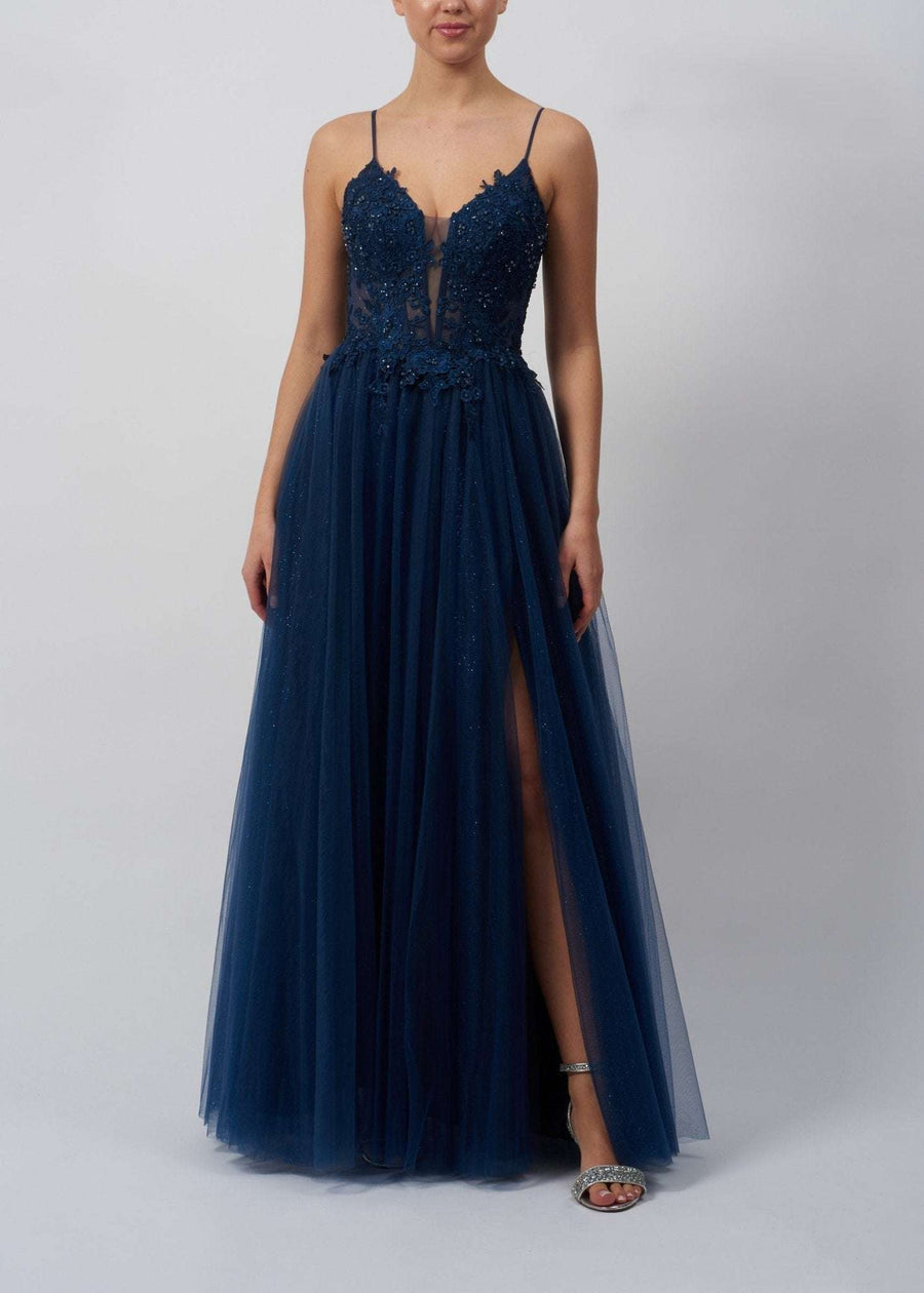 Mascara Navy Blue Ballgown MC11313 featuring floral appliqué bodice, tulle skirt, and thigh-high slit. Elegant choice for prom or formal events.