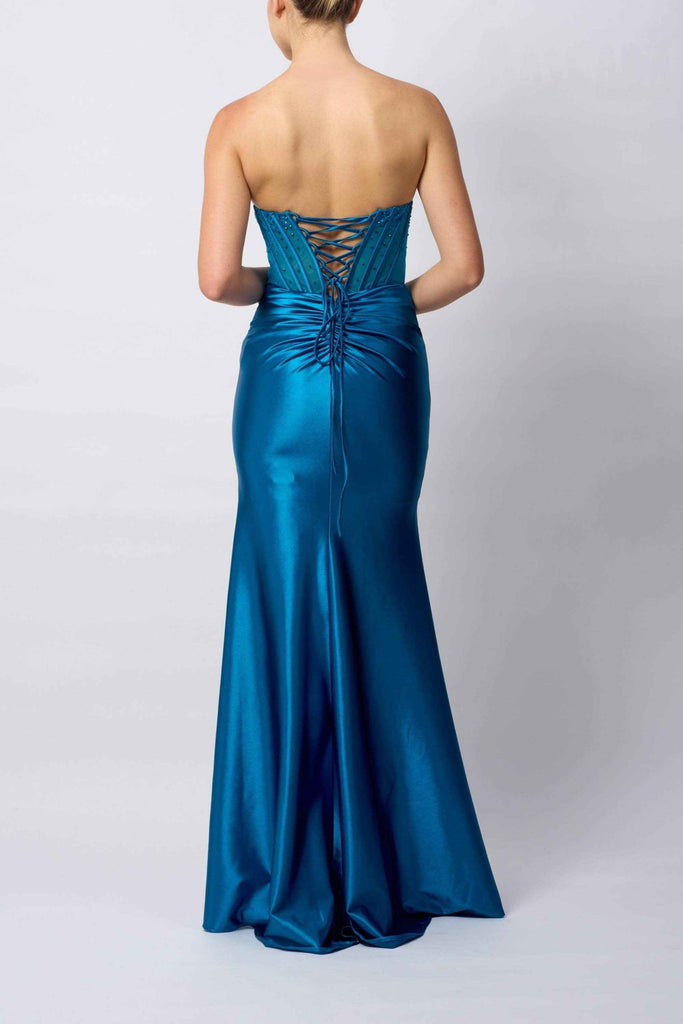 Back view of Mascara MC113423 BEADED BUST teal prom dress showing lace-up corset detail, ruched waist, and smooth satin mermaid silhouette.
