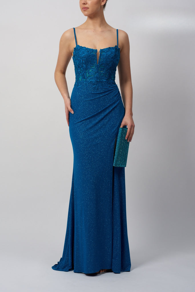 Mascara Teal Glitter Dress MC11342 features a fitted corset bodice with spaghetti straps and shimmering fabric, ideal for prom standout looks.