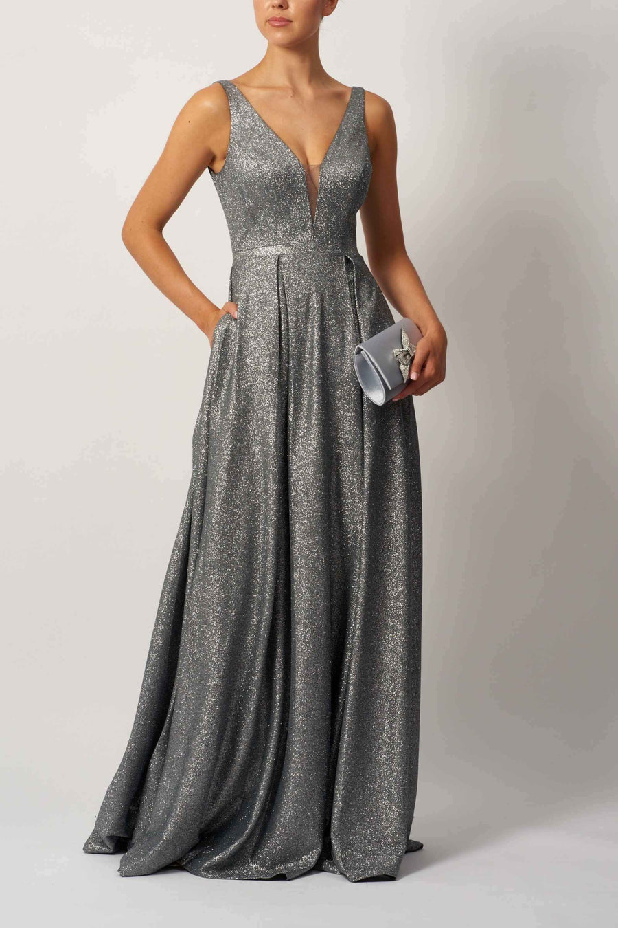 Mascara London MC113441 Sparkle Evening Gown in silver with deep V-neckline and pleated skirt, ideal for formal events and prom nights.