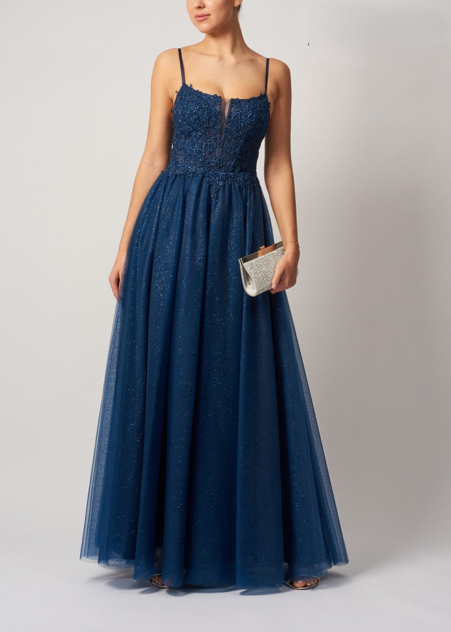 Back view of Mascara London MC11344 Wisteria Prom Dress showing sheer lace bodice and flowing navy tulle skirt in elegant eveningwear style.