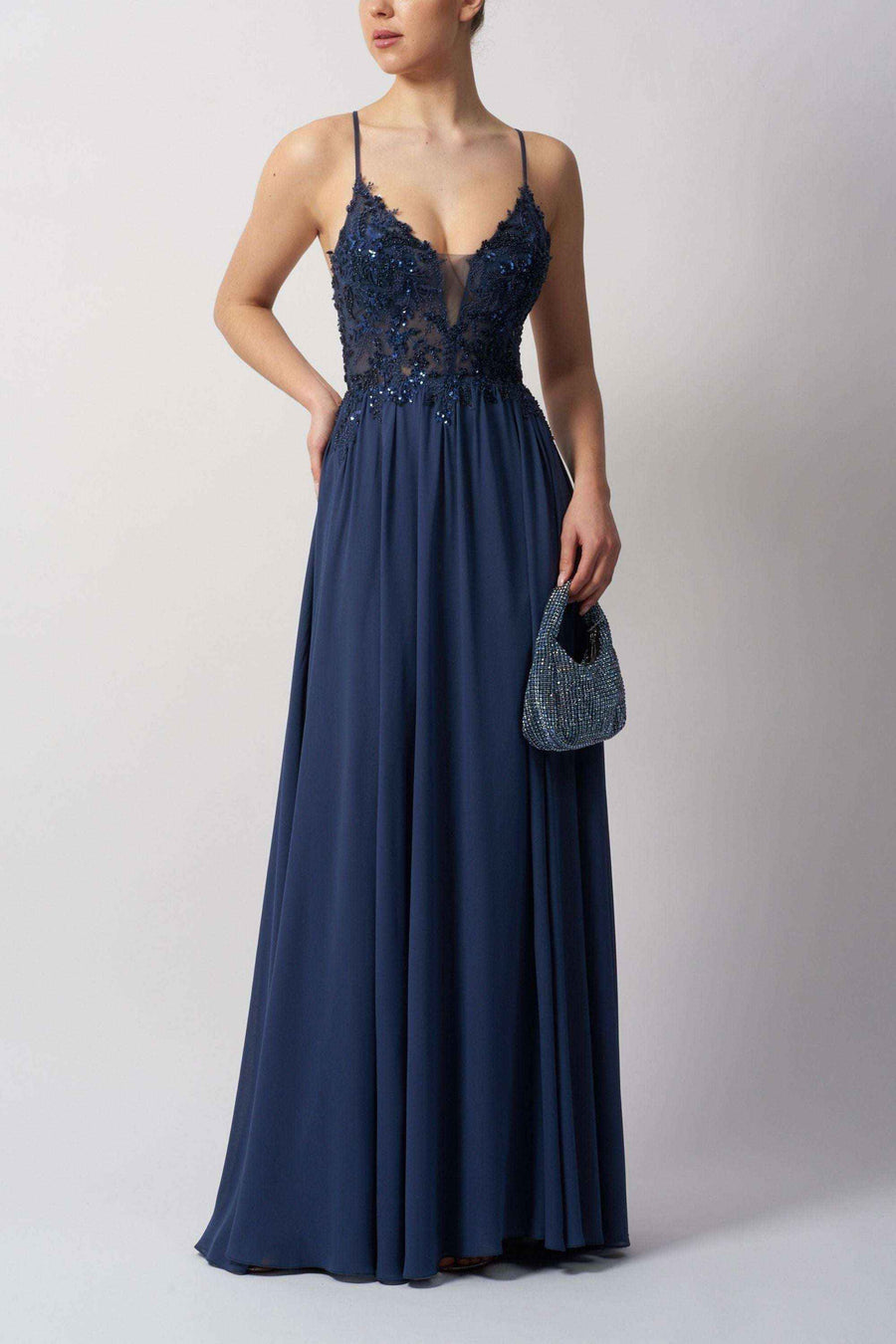 Mascara Chiffon Prom Dress in navy blue featuring floral lace bodice and flowing skirt. Ideal for prom, bridesmaid, or evening wear.