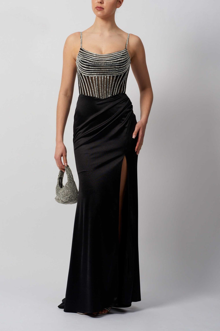 MC11445 Mascara Gown in black shiny jersey with embellished bodice and high slit. Perfect for prom, bridesmaid, or evening occasions.