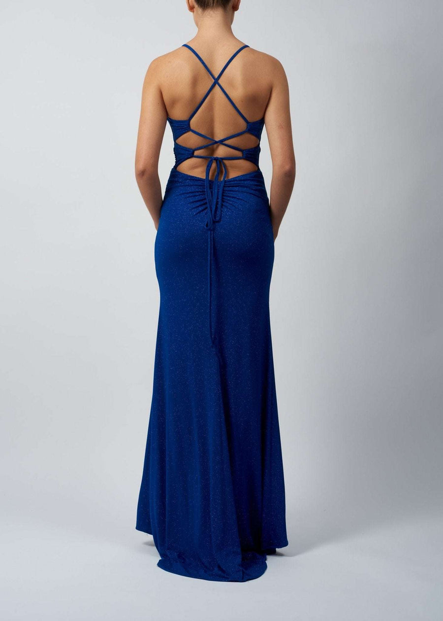 Mascara Jumpsuit - Green Glitter Cut-Out Bodice with tie-back and leg split shown from the back in a shimmering forest green jersey fabric.