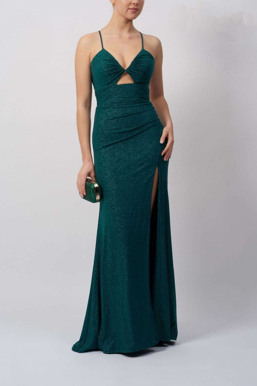 Mascara Jumpsuit in forest green glitter jersey with peek-a-boo cut-out bodice, tie-back detail, and thigh-high leg split for prom or formal wear.