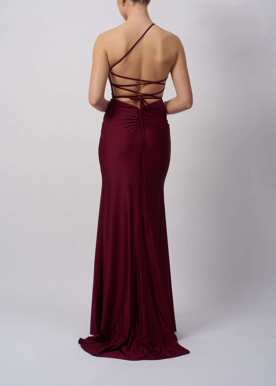 Back view of Wine Tie Back Dress MC12333 showcases a striking open back with crisscross tie detail, perfect for prom or evening wear.
