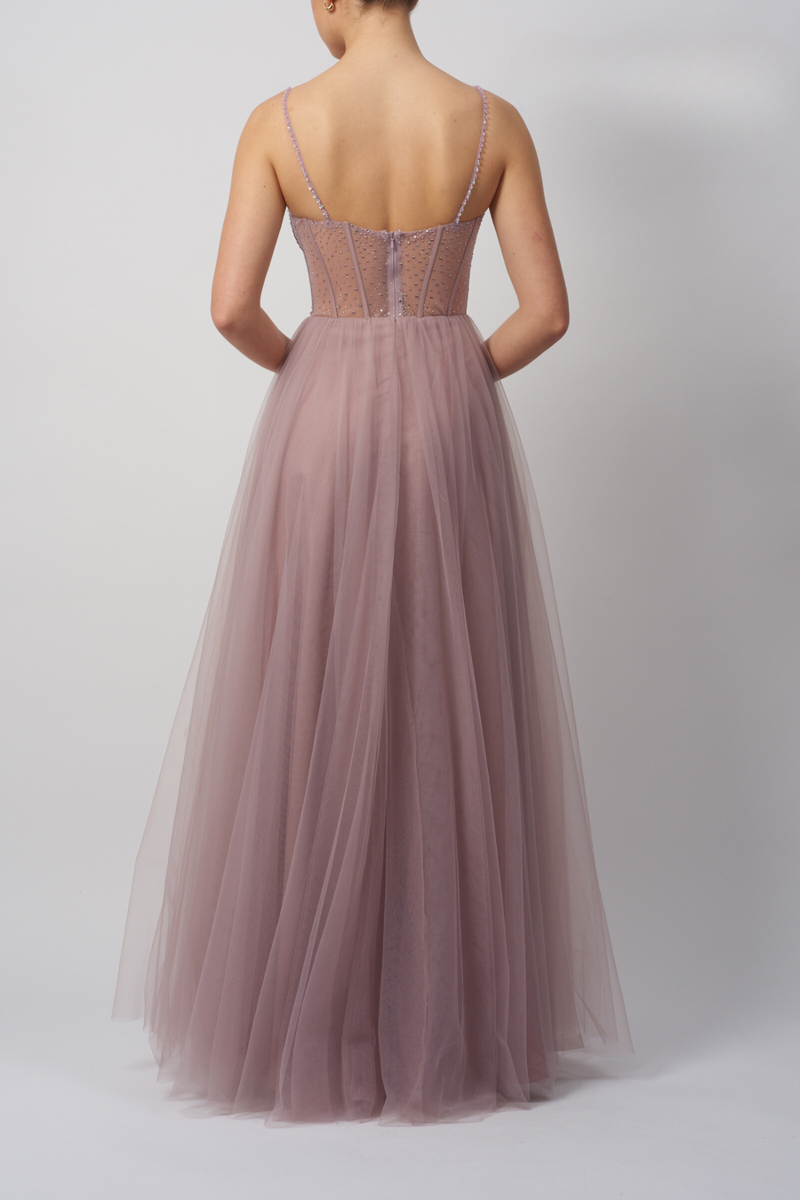 Back view of Mascara London MC124114 Forest Green Beaded Tulle Prom Dress featuring sheer corset bodice and flowing tulle skirt in elegant design.