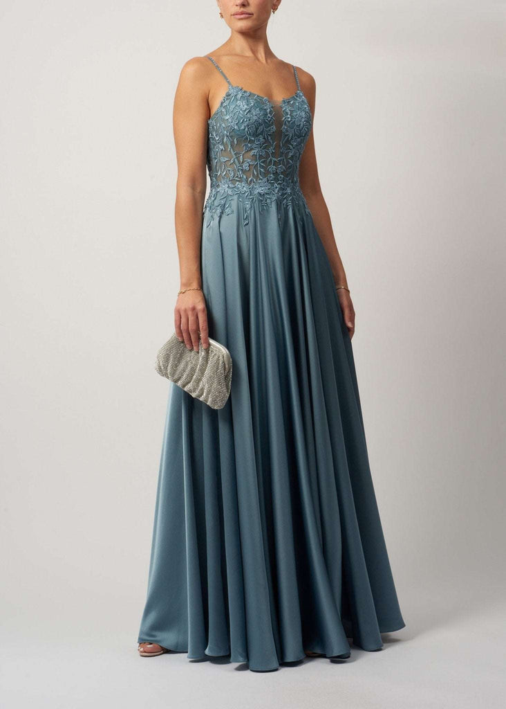 Dew Corset Dress in steel blue satin with lace applique bodice, sparkly gem straps, and flowing skirt. Ideal for bridesmaids or elegant events.