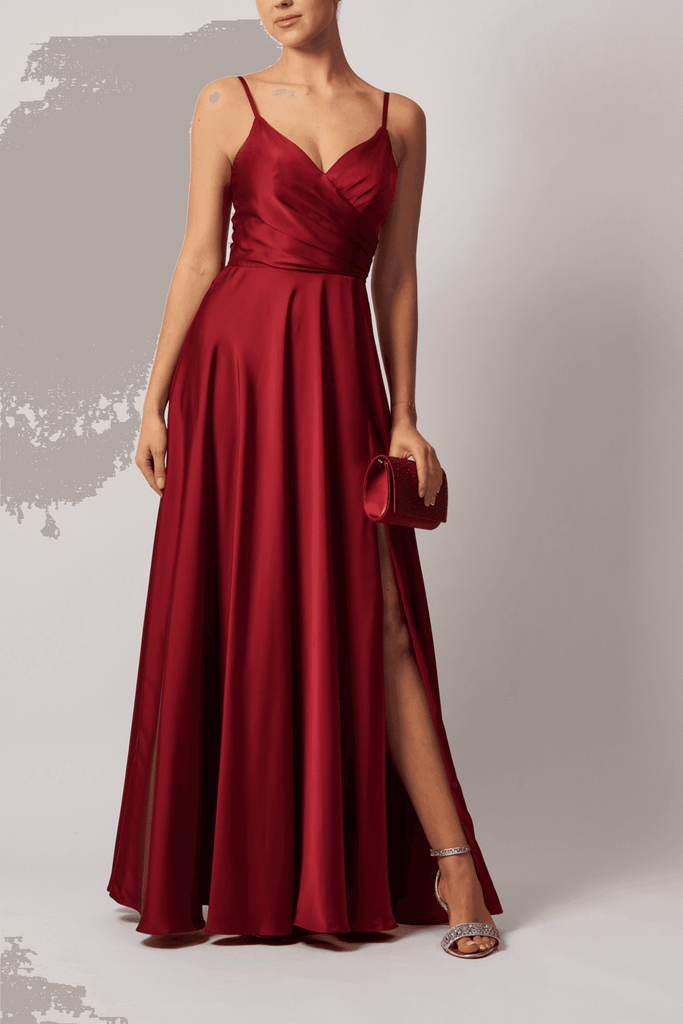"Burgundy satin evening gown with cross-pleated bodice and side slit by Mascara"

