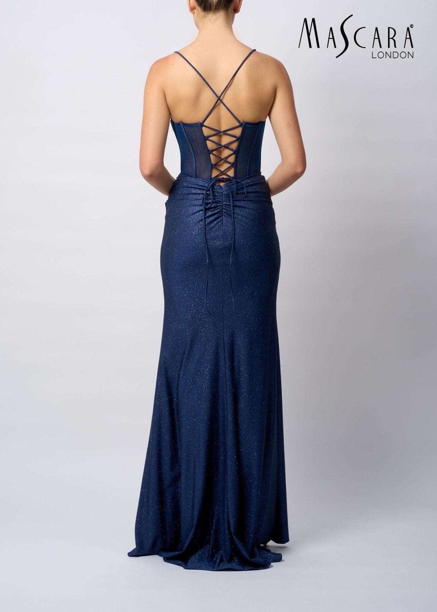 Back view of Mascara MC19427 Powder Blue Fitted tie back Jersey Prom Dress with lace-up corset detail and glitter finish, ideal for prom night.