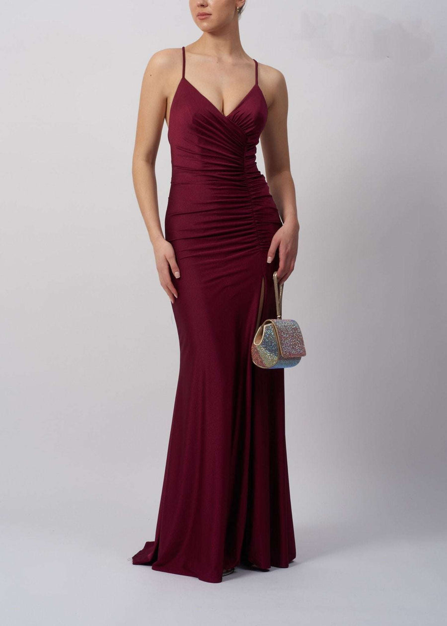 Mascara MC213326 wine jersey high split dress with tie back and ruched bodice, ideal for prom or formal evening events. Fitted silhouette enhances curves.