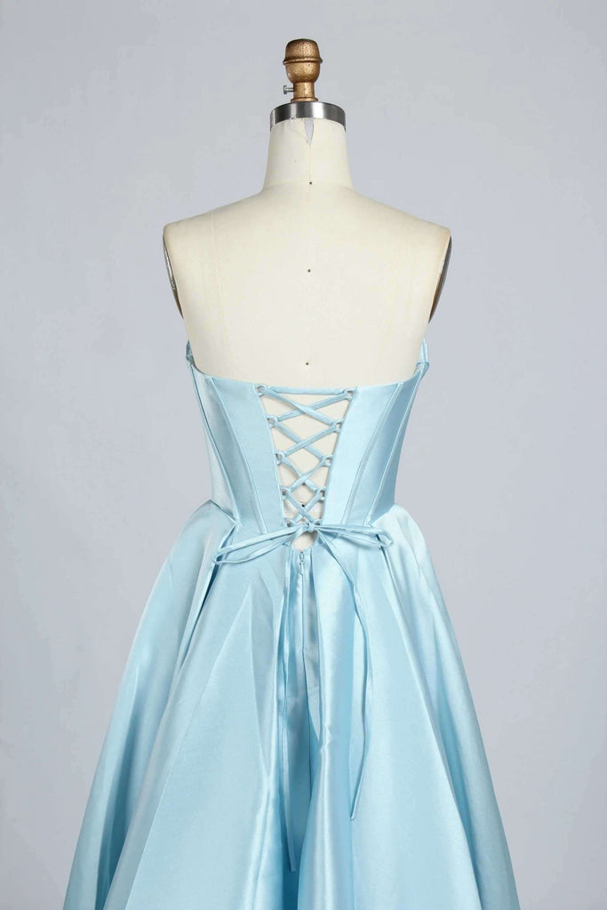 Detailed view of lace-up back design on the light blue satin Phoebe Prom Gown, showcasing adjustable fit and satin ribbon tie.