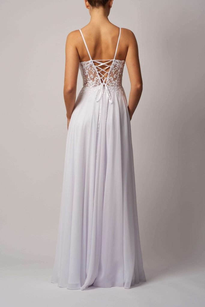 Ivory White Tie Dress featuring a lace-up back and flowing chiffon skirt. Elegant and versatile midi dress ideal for bridesmaids or special occasions.