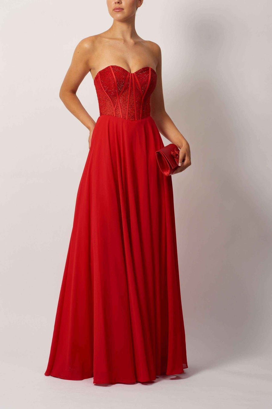 Red lace chiffon corset dress with strapless sweetheart neckline and elegant drape, perfect for prom or gala events.