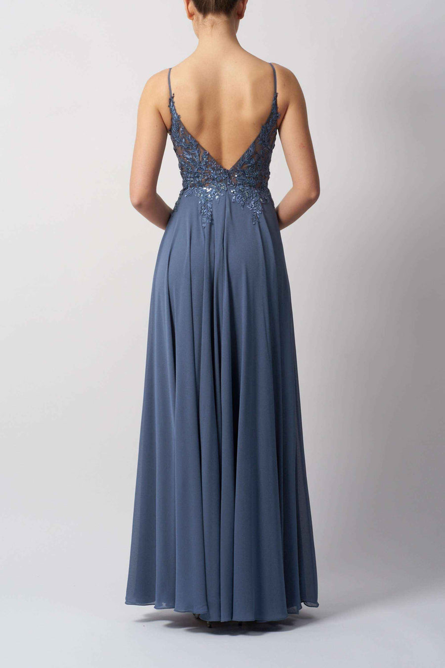 MC19442 Bridesmaid Dress - Chiffon by Mascara London in dusty blue, featuring a deep V-back, sequin lace bodice, and flowing chiffon skirt. Ideal for weddings or formal events.