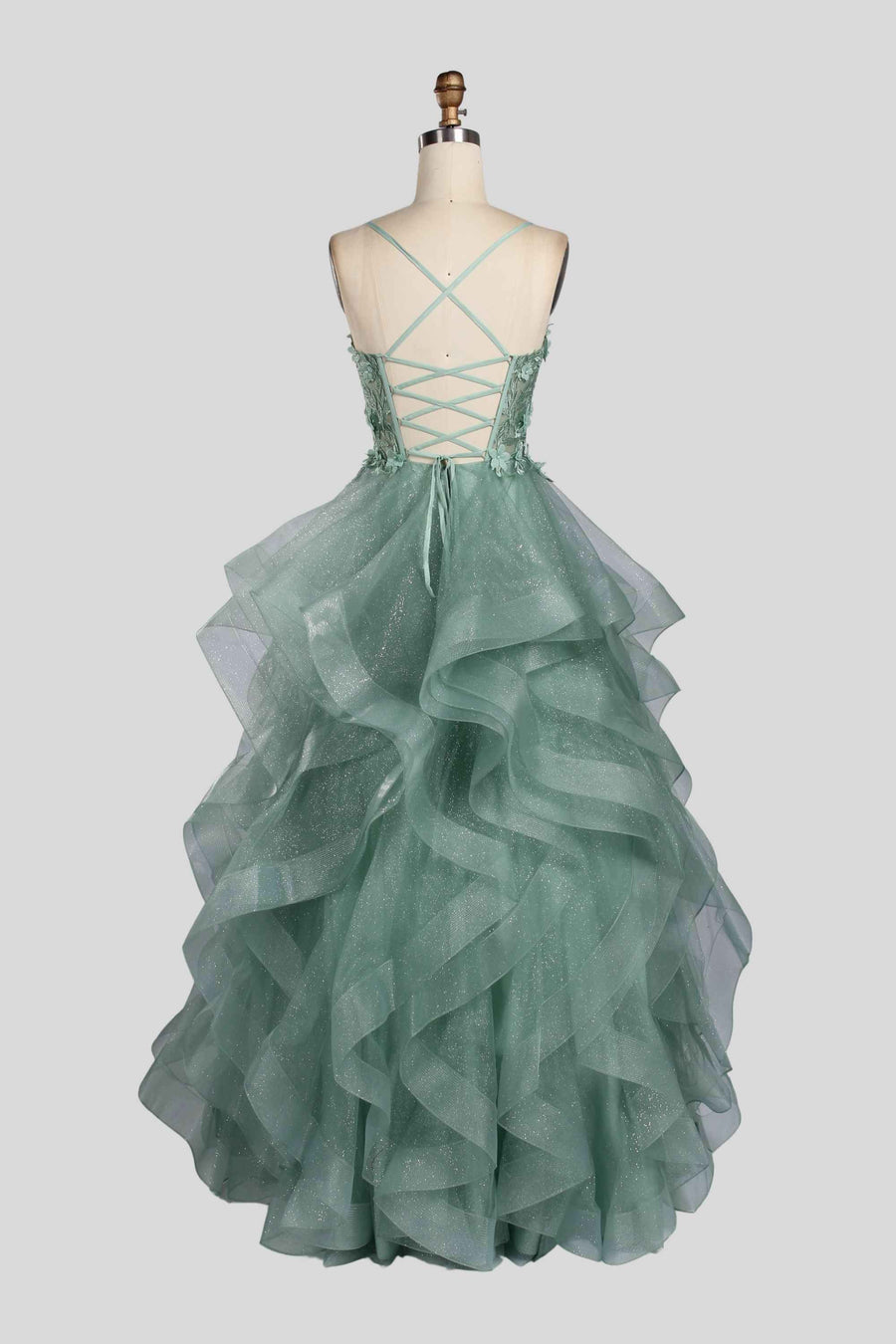 Back view of Jessica Stuart Sage Ball Gown showcasing lace-up corset and cascading ruffled layers in glittery sage tulle for elegant formalwear.