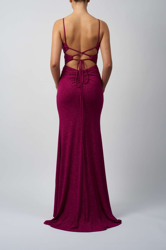 Mascara Tie Back Glitter Dress in deep magenta with sequin finish, featuring a custom-fit ruched back and elegant crisscross tie straps.