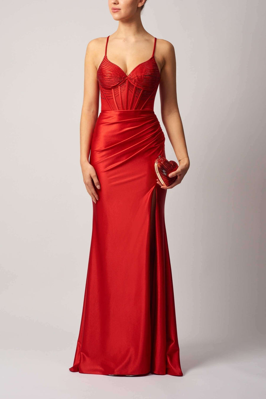 Satin evening dress in vibrant red with beaded bodice, fitted silhouette, and thigh-high slit, perfect for prom or formal occasions.