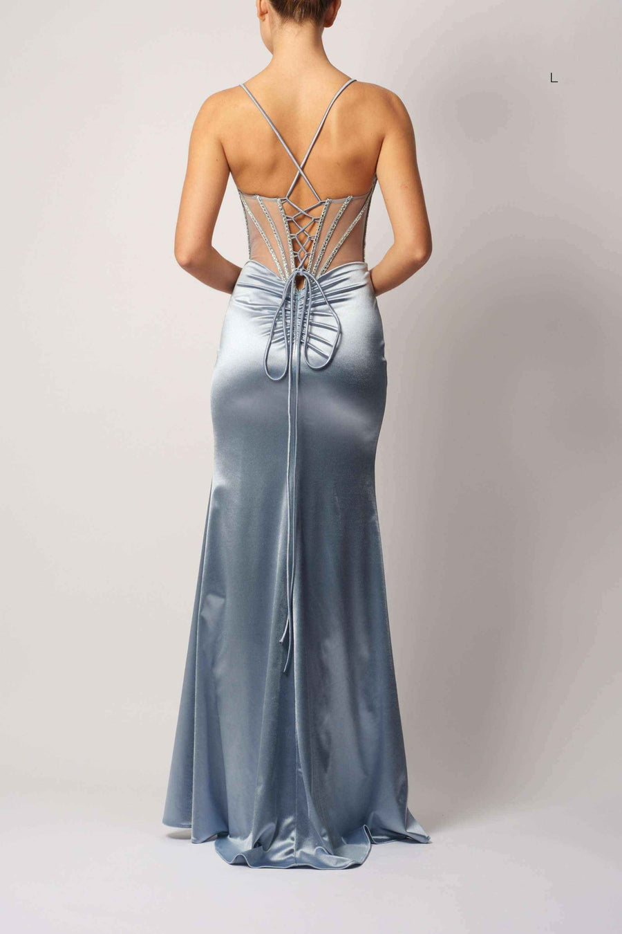 Back view of Mascara London MC11441 satin fitted gown in silver with lace-up corset detailing and floor-length silhouette for formal occasions.
