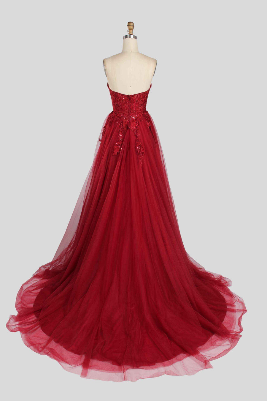 Back view of Jessica Stuart Luna strapless sequin ballgown in wine red with flowing tulle skirt and embroidered bodice, ideal for prom or gala.