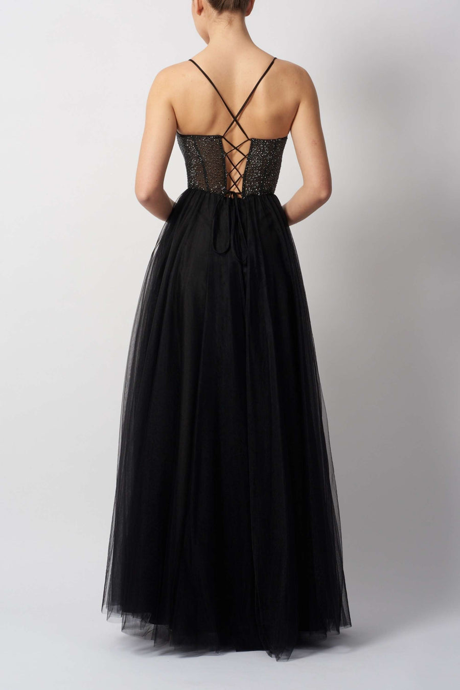 Back view of Pink Beaded Tulle Mascara MC295110 in black featuring lace-up corset and flowing tulle skirt for elegant evening wear.