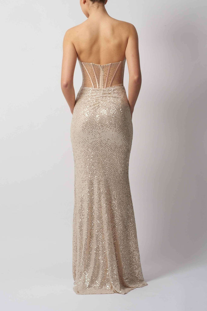 Back view of Silver Sequin Corset Gown - Mascara MC12443 showcasing the fitted silhouette, shimmering sequins, and sheer structured back panel.