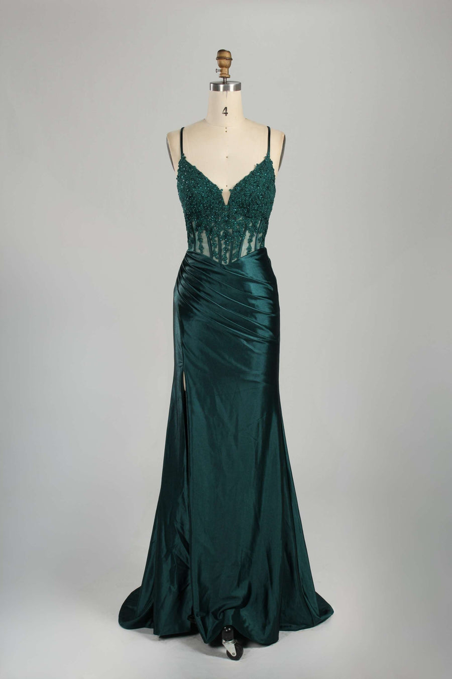 Front view of Blake Dark Teal Satin Prom Dress by Jessica Stuart featuring a corset bodice with lace detailing and a thigh-high slit. Ideal for prom or evening events.