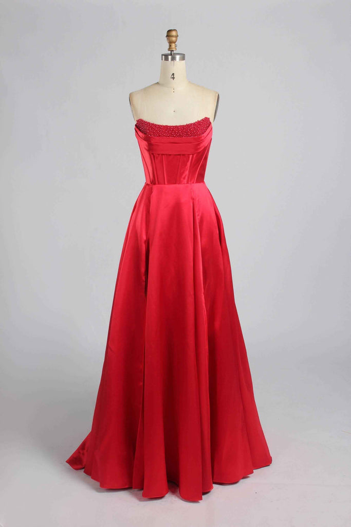 Jessica Stuart Red Pearl Evening Gown 33219B with pearl-embellished bodice and flowing satin skirt, perfect for black tie or red carpet events.