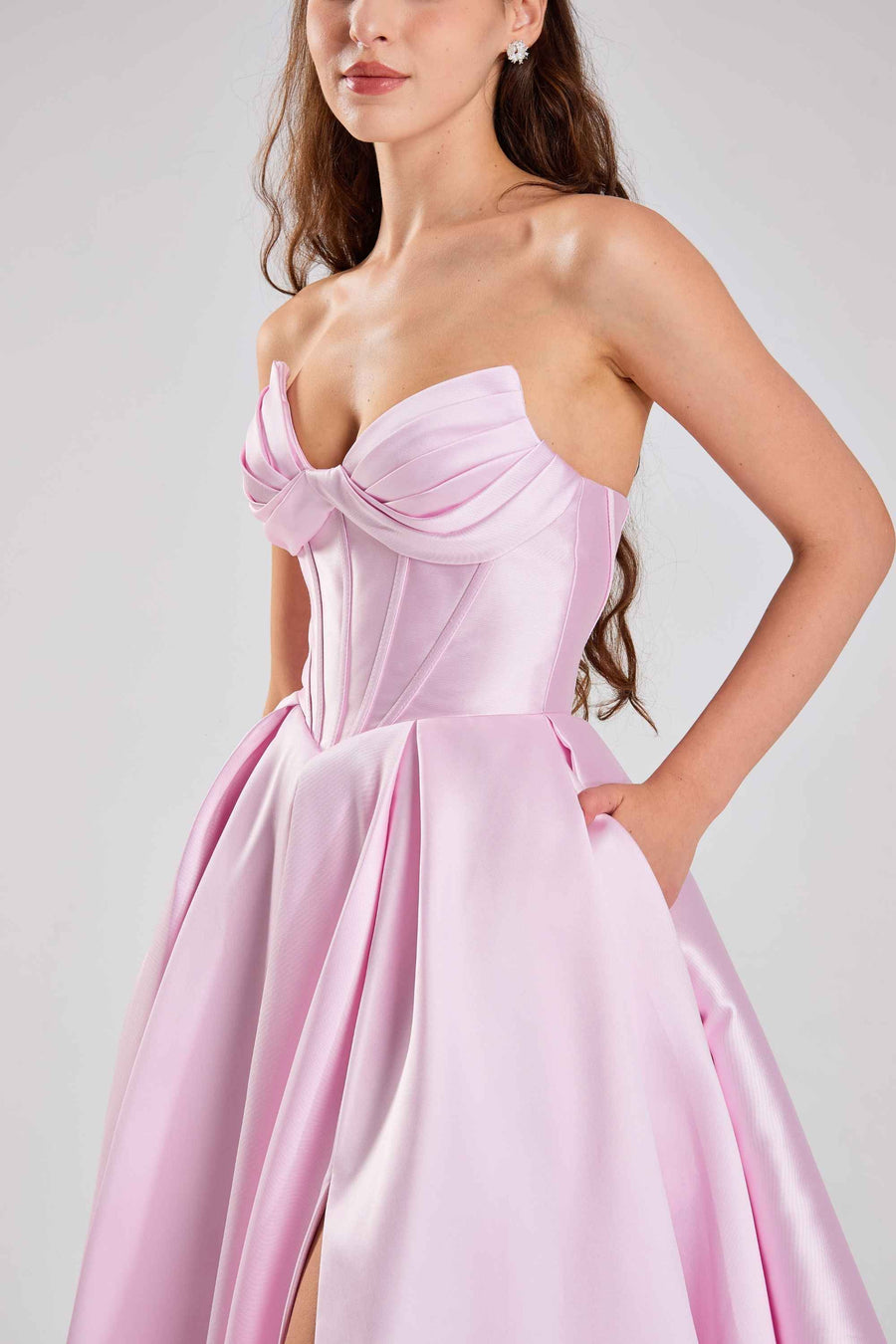Detail of Jessica Stuart Dress - Pink Satin Prom | Strapless, Corset with hidden pocket and pleated satin skirt, combining style and function.