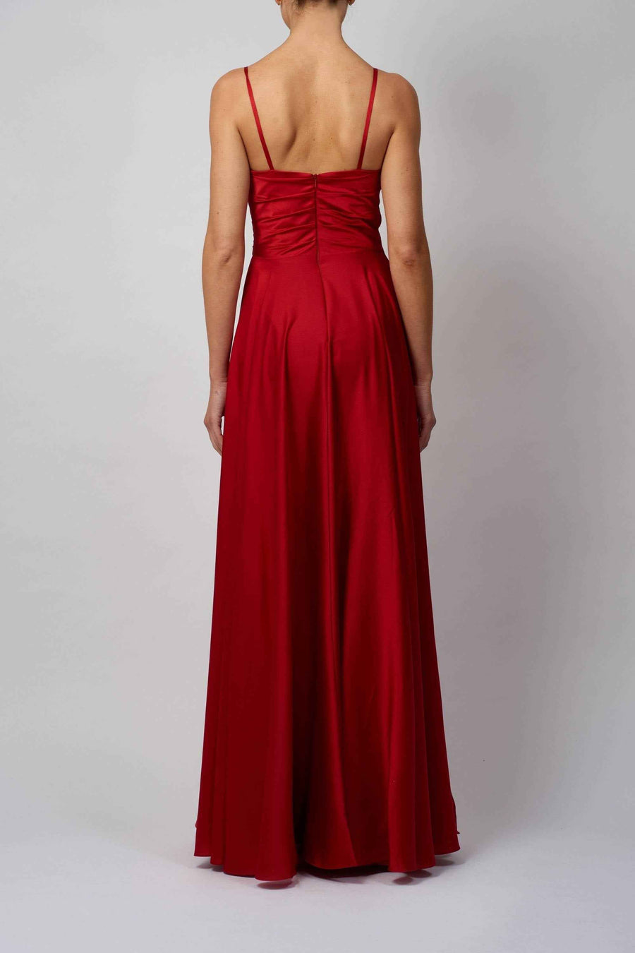 Back view of Mascara London MC220123 dress in red satin, featuring ruched bodice and flowing A-line skirt with spaghetti straps.