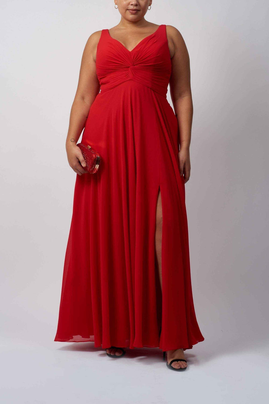Plus size red chiffon dress with knot front bodice and thigh-high slit, ideal for formal events like prom or weddings.