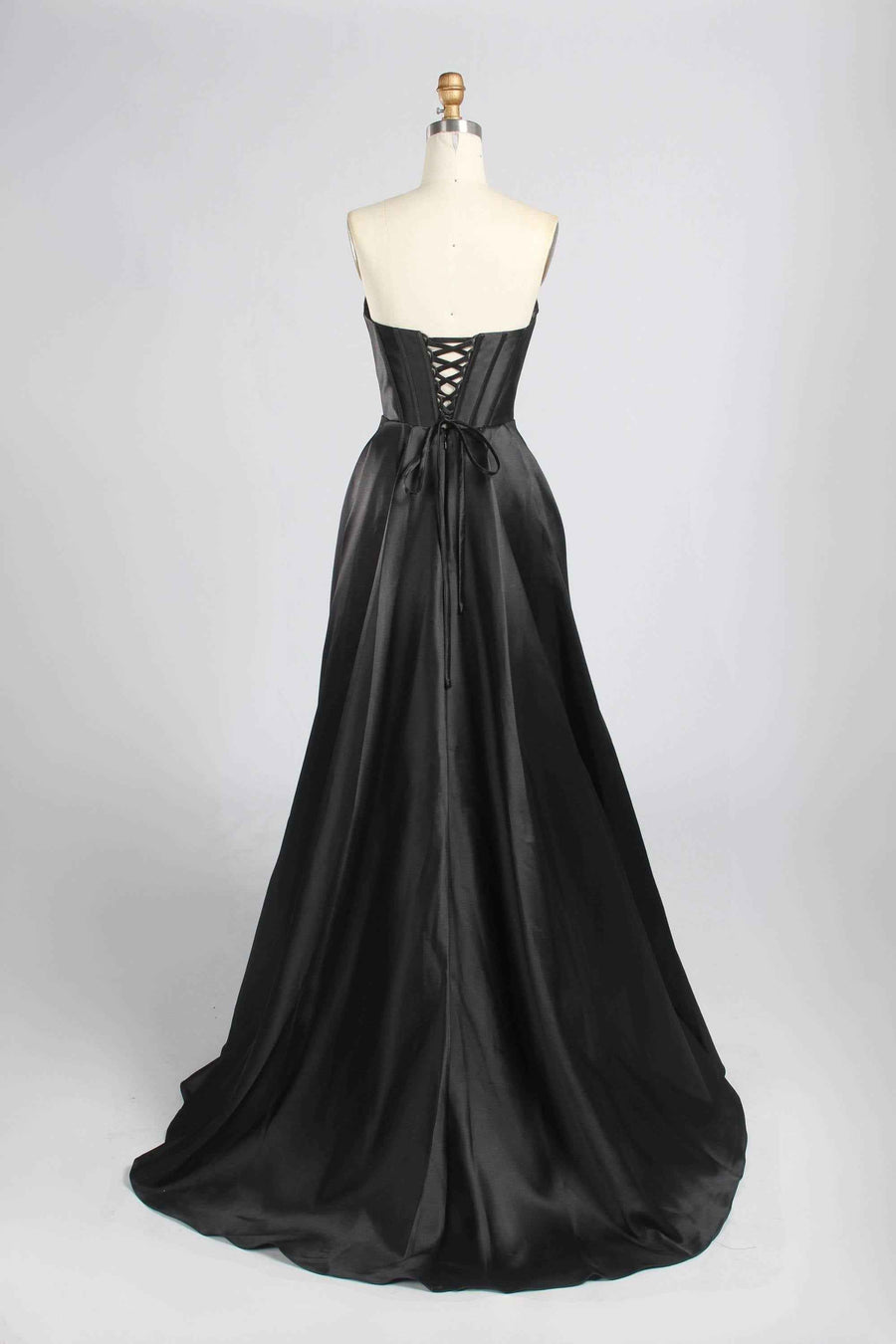 Back view of Jessica Stuart Black Pearl Gown showcasing lace-up corset closure and elegant satin train, perfect for galas or red carpet.