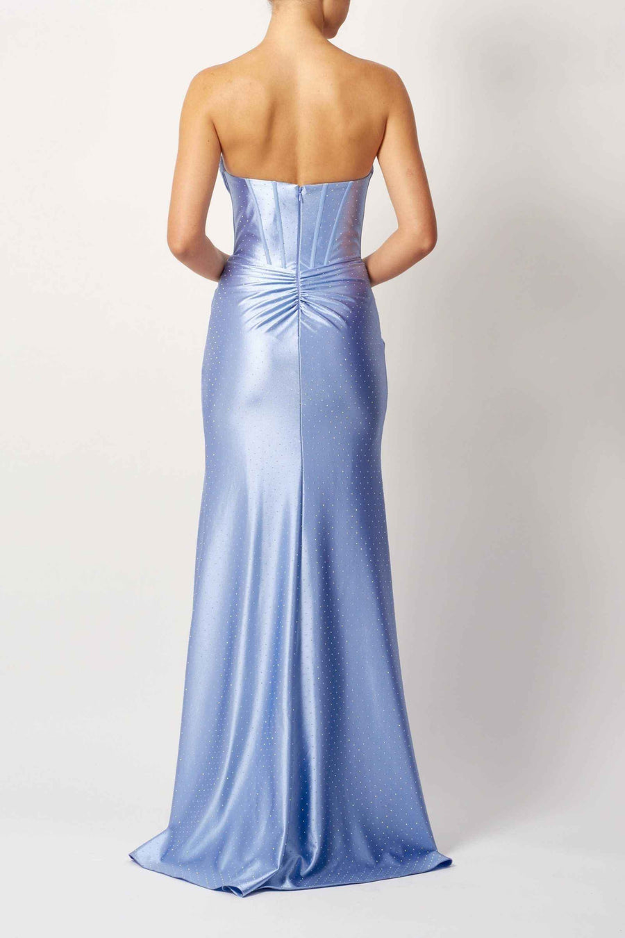 Back view of Baby Blue Beaded Satin Gown with a fitted silhouette, ruched lower back, and subtle sparkle, ideal for prom or formal occasions.