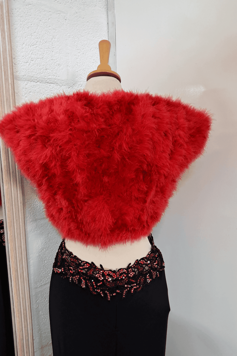 Back of red feather shrug