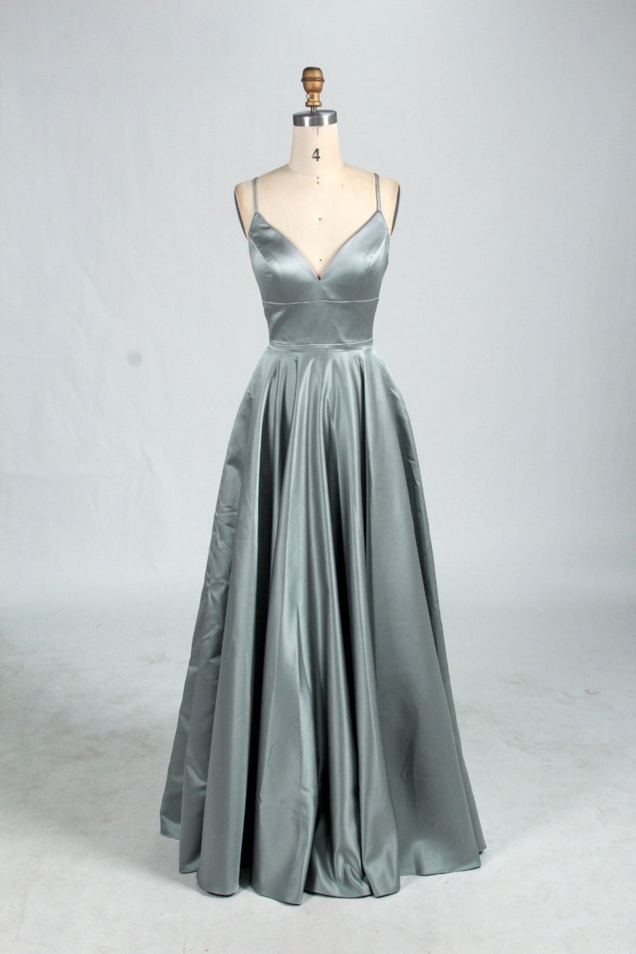 Dark Sage Green AVA prom dress with full satin skirt, V-neckline, thin straps, and open back design, ideal for formal events and prom nights.