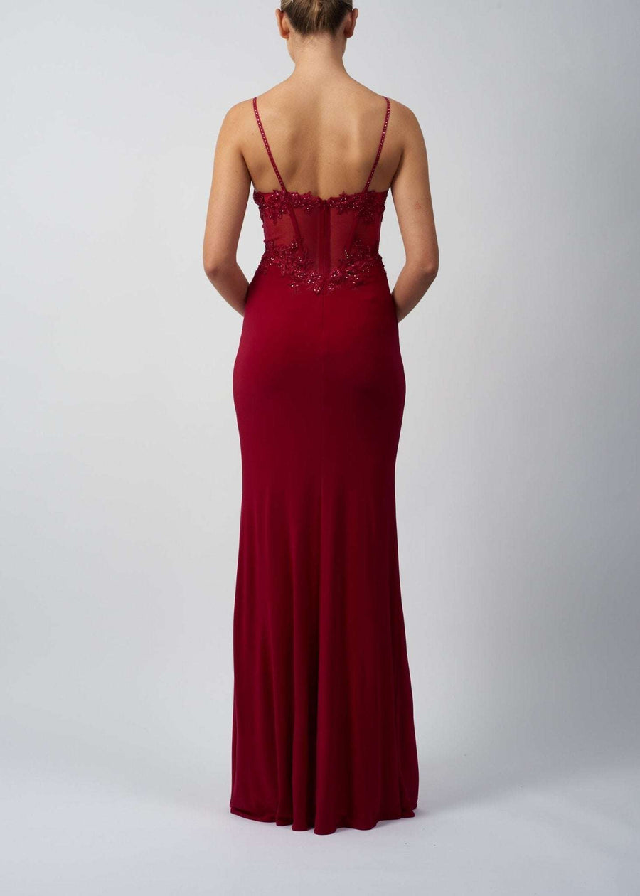 Back view of Berry Jersey Corset Prom Dress by Mascara featuring sheer corset detailing and slim-fit jersey fabric, ideal for evening events.