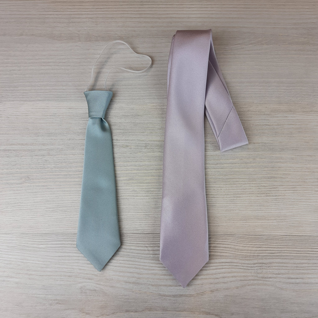 Peacock Boys Ties in two sizes: elasticated tie in light blue and self-tie in lilac, ideal for ages 5-12. Dry clean only.