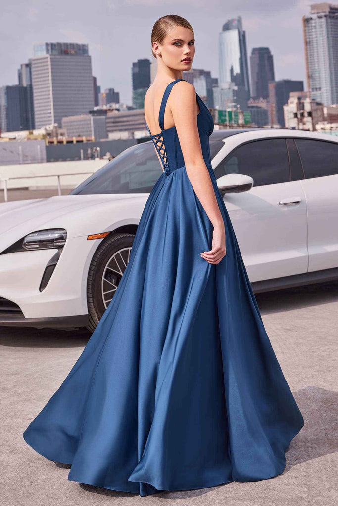 Back view of navy A-line satin dress with lace-up corset and wide straps, showcasing elegant flow and structured fit for formal occasions.