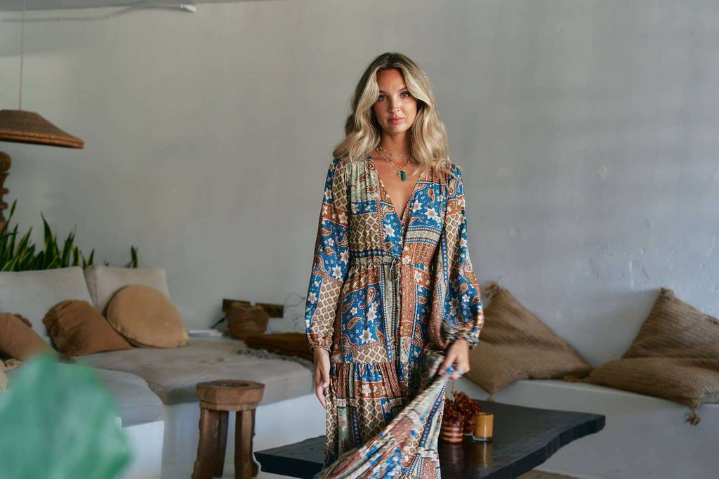 Teresa Maxi Dress - Izabelle Print in brown and blue bohemian pattern, worn indoors with relaxed summer styling. 100% rayon for breezy comfort.