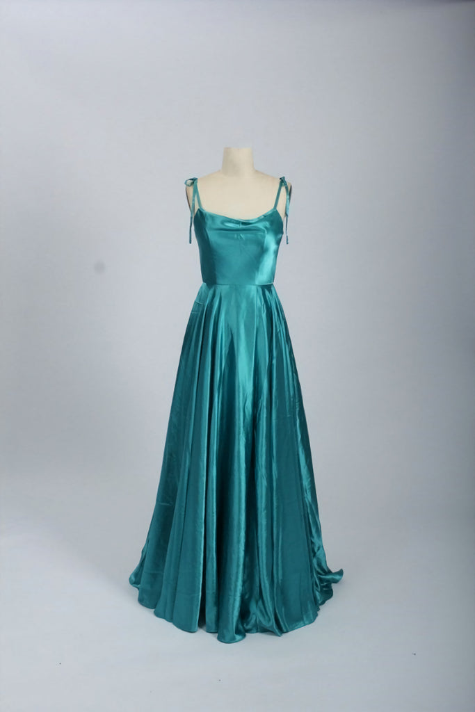 Abby Teal Ballgown in satin with tie-up straps and full-length skirt. Elegant teal dress with pockets, ideal for prom, weddings, or evening events.